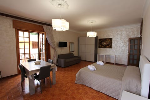 Appartamento Comfort (Edificio Separato) | Living area | Flat-screen TV