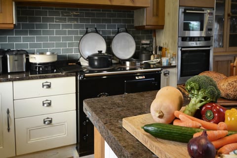The kitchen has an Aga as well as a double electric oven
