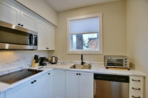 Accessible Studio Suite | Private kitchen | Full-size fridge, microwave, dishwasher, coffee/tea maker