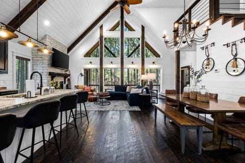 Absolutely breathtaking views of towering pine trees and gorgeous natural light greet you through floor-to-ceiling windows.