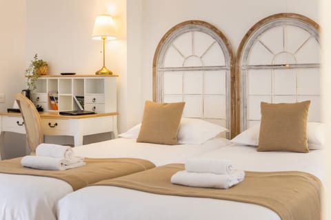 Twin Room | Blackout drapes, iron/ironing board, free WiFi, bed sheets