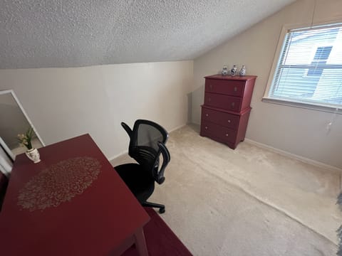 Dressing area with a vanity, could easily be used as a quiet office space also.