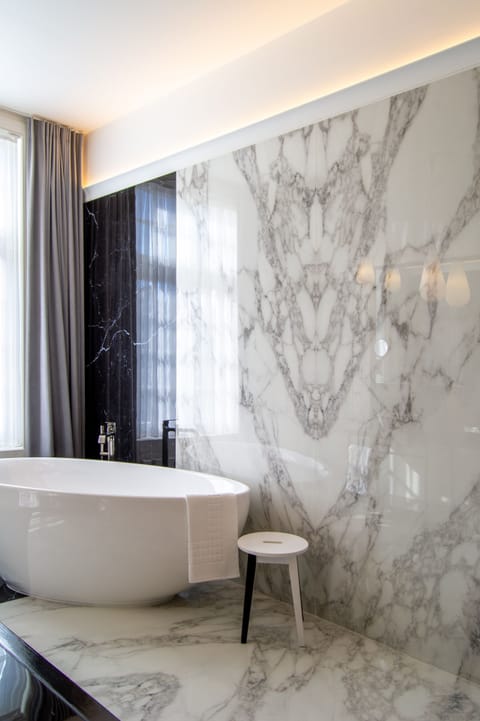 Luxury Suite | Bathroom | Designer toiletries, hair dryer, bathrobes, slippers