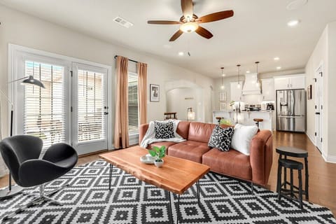 If you follow the entry hallway to the end, you'll enter our bright, open concept living, kitchen and dining area.