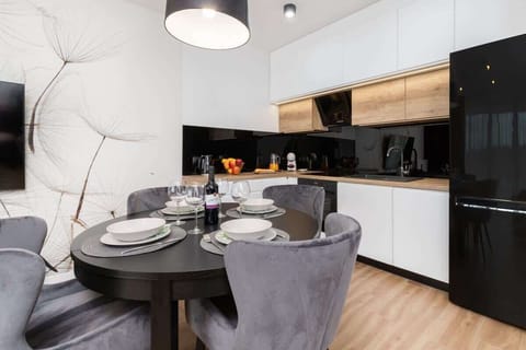 Bright kitchenette with cooking utensils. 