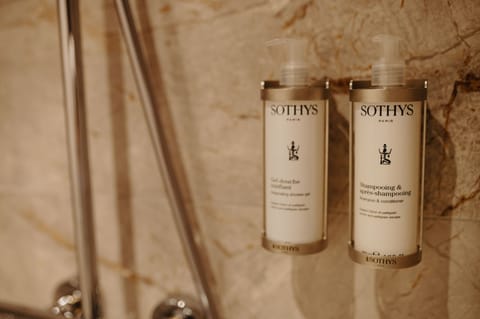 Shower, rainfall showerhead, hair dryer, towels