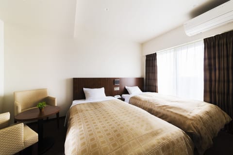 Twin Room, Non Smoking | Blackout drapes, iron/ironing board, free WiFi, bed sheets