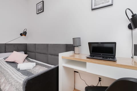 A functional corner featuring a small desk and chair, ideal for a work or study setup within the living space.