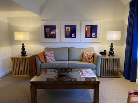 Spacious Super King Suite | Living area | Flat-screen TV