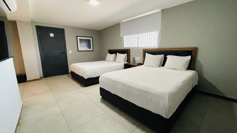 Quadruple Room | In-room safe, desk, free WiFi, bed sheets