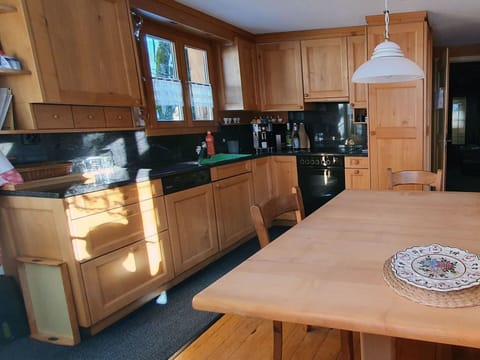 Cabinetry, Furniture, Countertop, Kitchen Appliance, Kitchen, Table, Kitchen Stove, Wood, Home Appliance, Interior Design