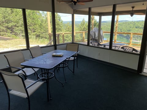 16x16 screened in porch with access to full length lakeside deck. 