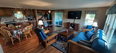 Open concept kitchen/dining/ living with big screen TV.  