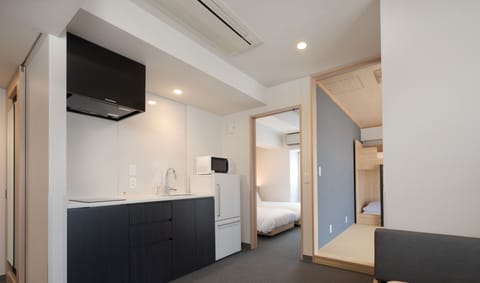 Two-Bedroom Japanese Apartment, Non Smoking | Down comforters, in-room safe, desk, iron/ironing board