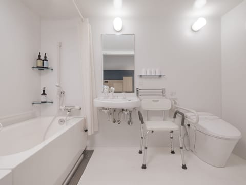 Accessible Family Apartment | Bathroom | Separate tub and shower, deep soaking tub, free toiletries, hair dryer