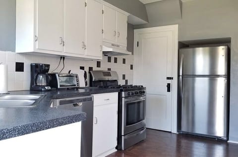 Side B: Essential kitchen utensils and cookware are available. (1st Floor)