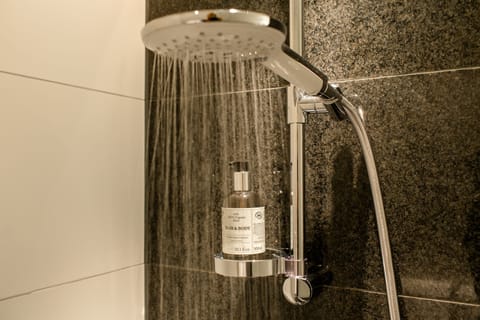 Shower, hydromassage showerhead, hair dryer, towels