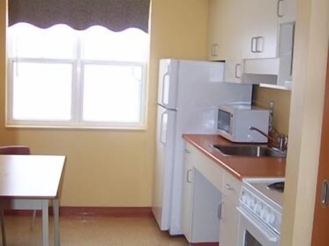 Apartment, 2 Bedrooms | Private kitchen | Fridge, microwave, oven, stovetop