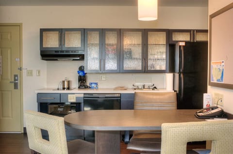 Suite, 1 Bedroom | Private kitchen | Full-size fridge, dishwasher, cookware/dishes/utensils