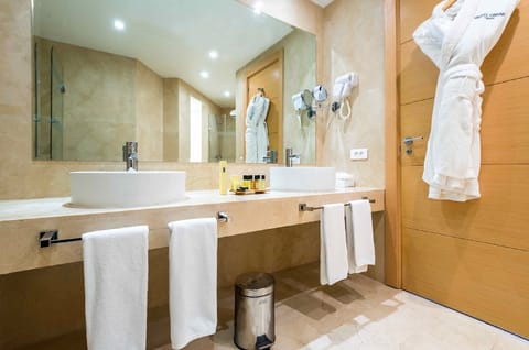 Combined shower/tub, free toiletries, hair dryer, bathrobes