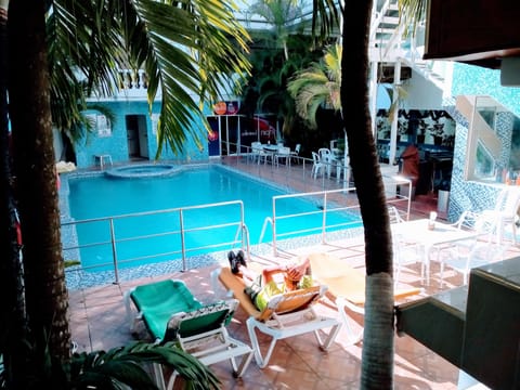 Indoor pool, outdoor pool, open 7 AM to 7 PM, pool umbrellas