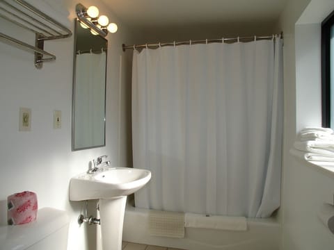 Room, 2 Queen Beds, Kitchenette | Bathroom | Combined shower/tub, hair dryer, towels