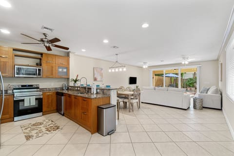 View of open kitchen, dining and living