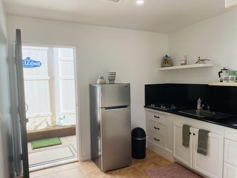 Premium Studio, 1 King Bed, Hot Tub, Courtyard Area | Private kitchen | Mini-fridge, microwave