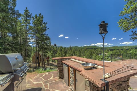 Outdoor kitchen with grill and fridge