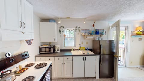 Efficient but well stocked kitchen allows you to make some meals at home.