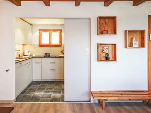 Cabinetry, Property, Countertop, Picture Frame, Wood, Building, Orange, Interior Design, Architecture, Flooring