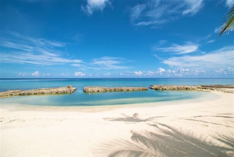 On the beach, white sand, free beach cabanas, sun loungers