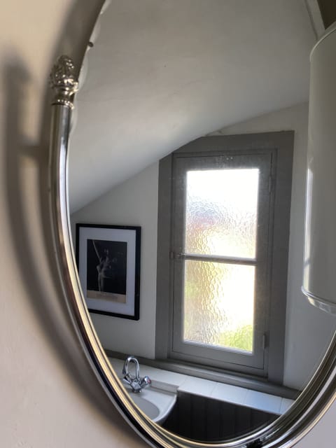 Downstairs cloakroom with antique mirror