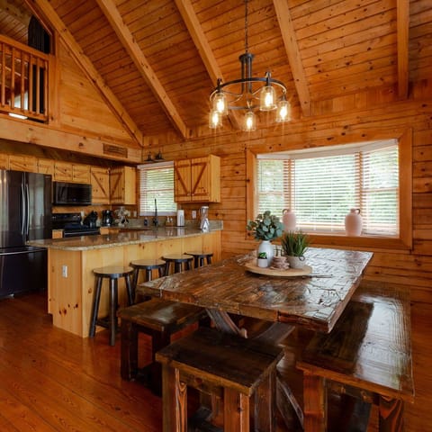 Here's the dining room that shares a delightful connection with the staircase.