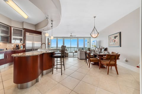 Effortless flow and abundant natural light characterize this stunning condo. The kitchen's thoughtful design and open layout create an inviting atmosphere for both cooking and gathering.