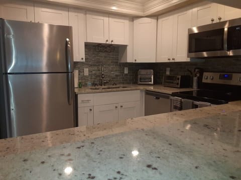 Condo, Multiple Beds, Kitchen, Beach View | Private kitchen | Fridge, microwave, oven, stovetop