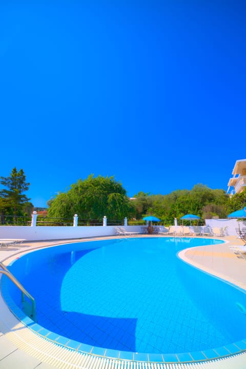 Outdoor pool, open 5:30 AM to 8 PM, pool umbrellas, sun loungers