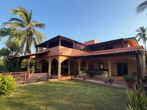 Lower level is all open air.
2 bedrooms upstairs, 1 at ground level.