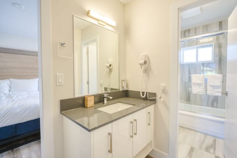Superior King Suite Lake View and Patio | Bathroom | Hair dryer, towels