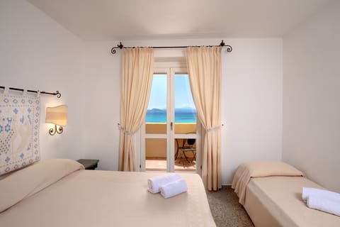 Deluxe Triple Room, Sea View | Minibar, in-room safe, desk, free WiFi