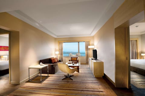 Deluxe Suite, 2 Bedrooms | Living area | 40-inch LED TV with cable channels, TV