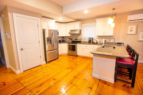 Deluxe Suite, 2 Bedrooms | Private kitchen | Full-size fridge, microwave, oven, stovetop