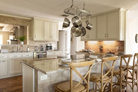 A pristinely-clean kitchen with high-end pots/pans and everything you need.