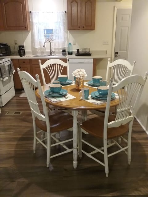 Full dining setup. Back door leads to porch makes it easy for grilling.