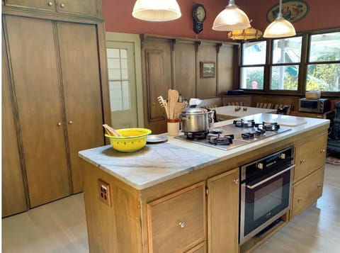 Kitchen with dining nook beyond