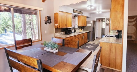 Dining table and kitchen.