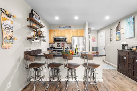 Inviting bar-style kitchen perfect for morning coffee or evening wine.