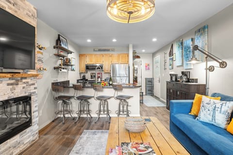 Transition seamlessly from the living room to the kitchen.