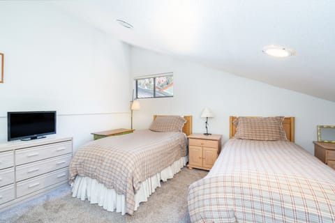 Bedroom 2 features two twin beds.