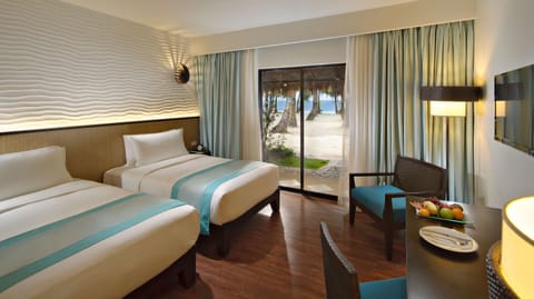 Deluxe Double or Twin Room Beach Front | Minibar, in-room safe, desk, laptop workspace